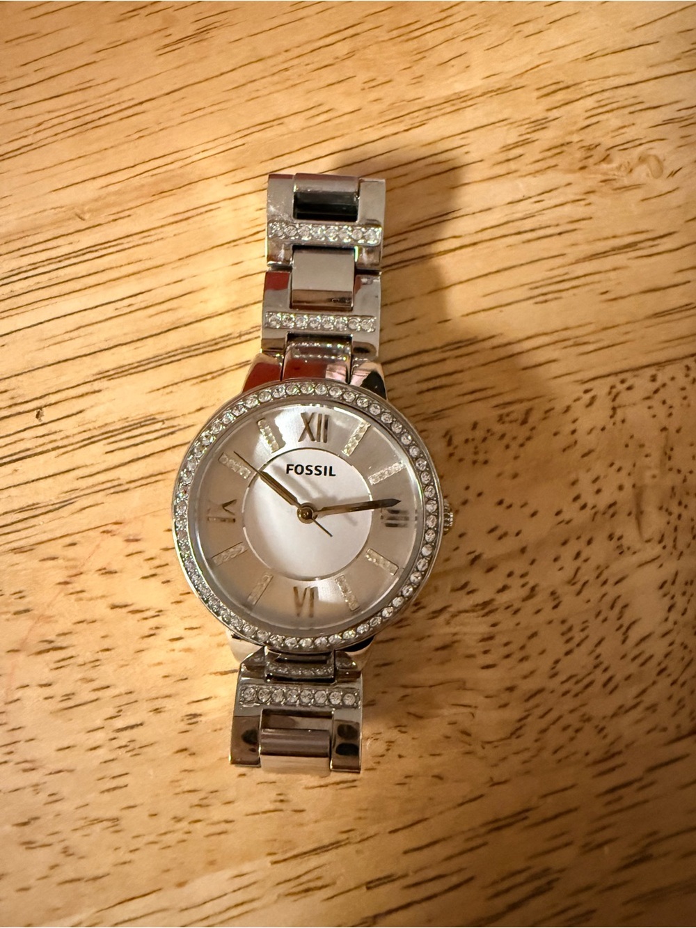 Wristwatch on wooden surface
